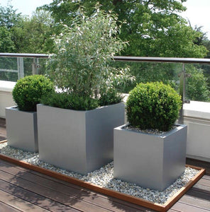 Modern square aluminium finish garden planters. Lightweight fibreglass Geo cube garden planters, made in the UK