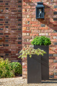 Modern tall square dark grey faux lead finish fibreglass planters made in the UK